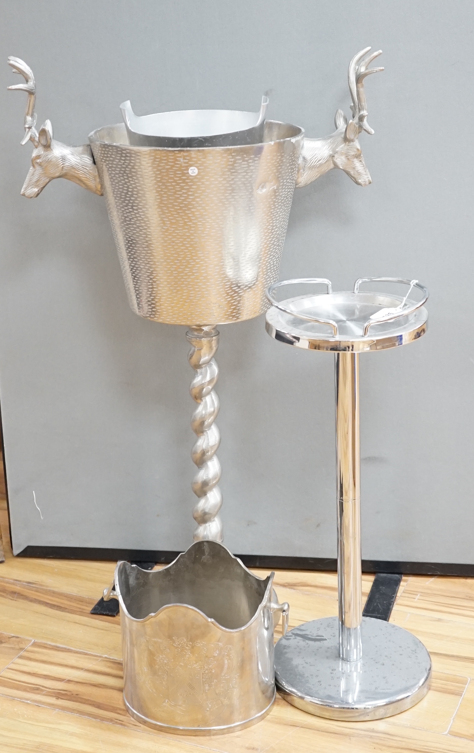 An aluminium stag handled floor standing wine / champagne cooler, another and three table top wine coolers, tallest 86cm high